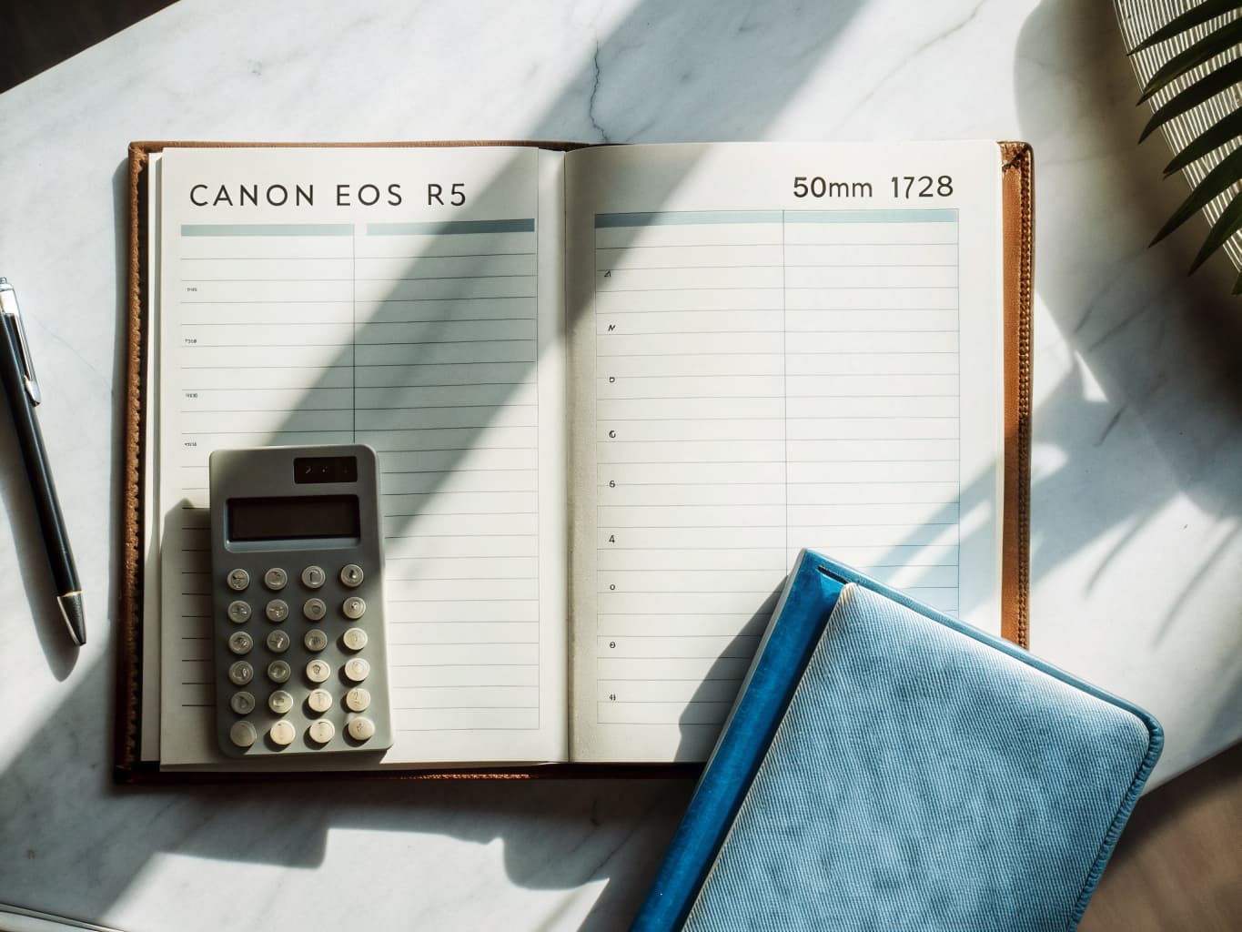 Professional bookkeeping workspace with ledger and calculator